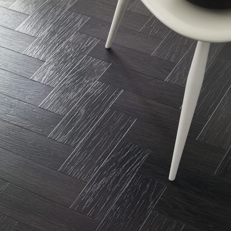 https://johnastonflooring.co.uk/wp-content/uploads/2022/05/Amtico-Form-Coal-Grained-Oal-in-Parquet-Laying-Pattern-Cameo-scaled-800x800.jpg